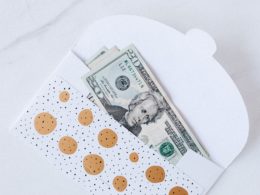 $20 bill in sparkly holiday envelope
