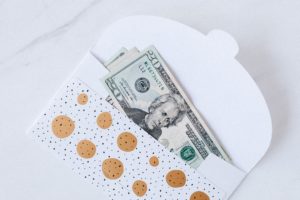 $20 bill in sparkly holiday envelope