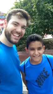 Big Brother Big Sister mentor and mentee smiling at amusement park