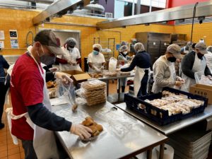 Bank of America volunteers by packaging food in Feed More's community kitchen, February 2022.