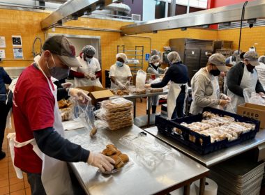 Bank of America volunteers by packaging food in Feed More's community kitchen, February 2022.