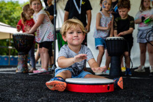 Little boy playing drum