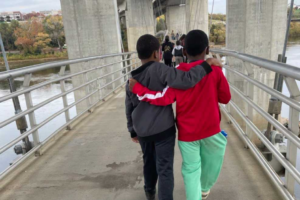 children walking across a bridge in Richmond VA