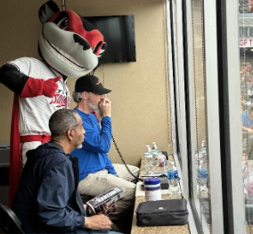 Image of live audio describers at a baseball game