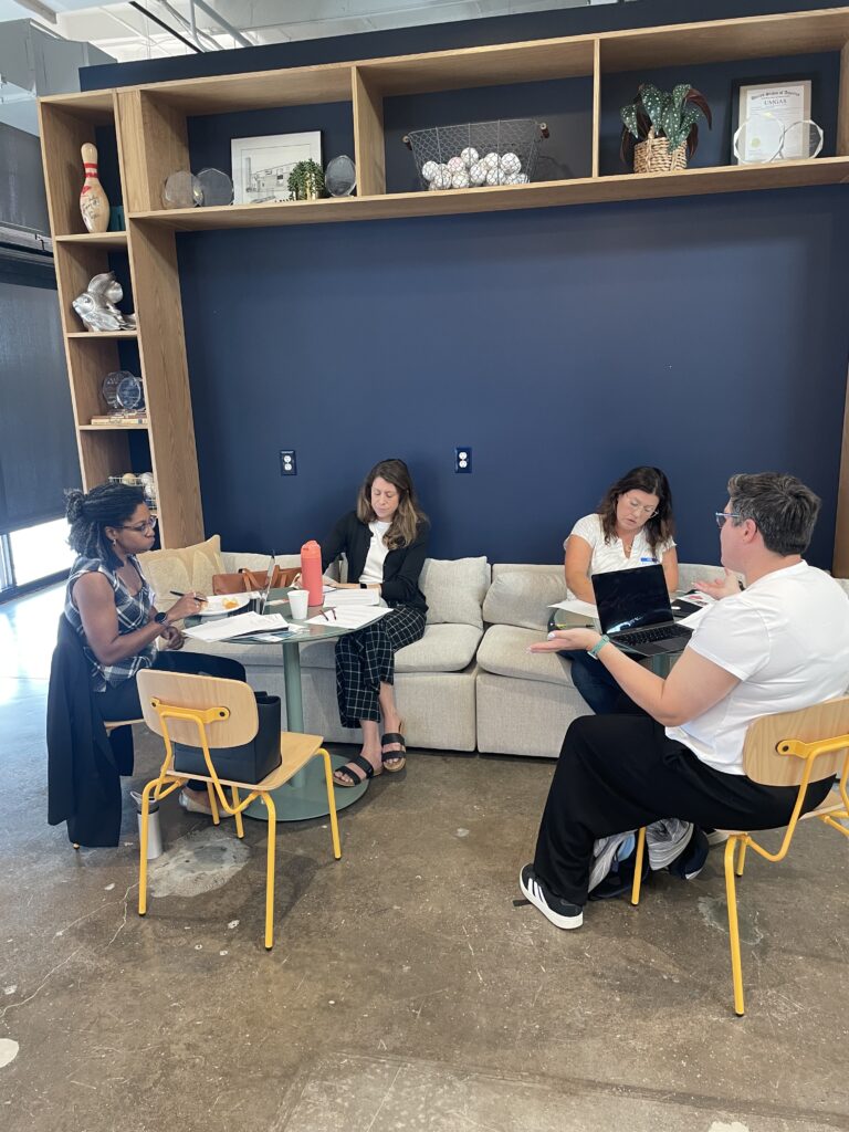 Sylvia's Sisters meets with marketing volunteers.