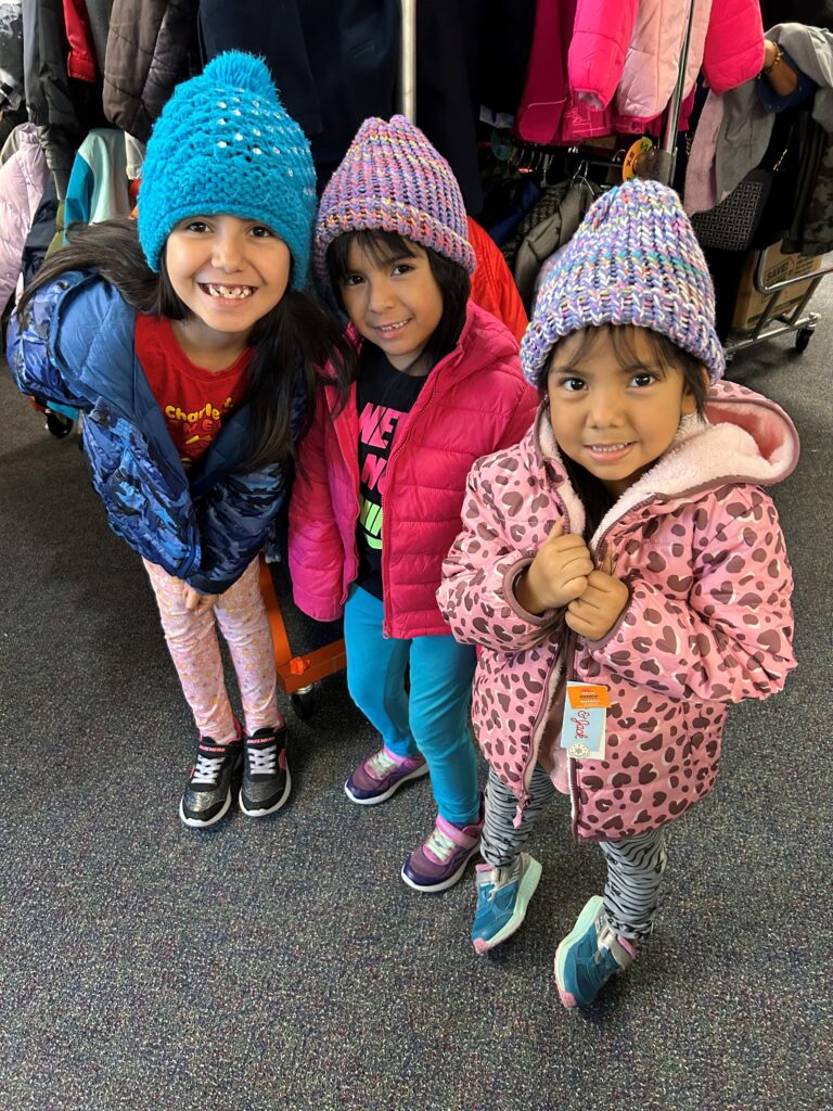 three girls in winter clothing