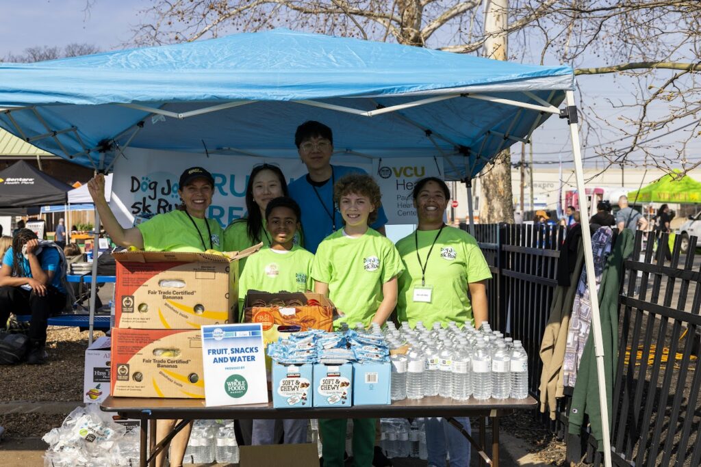 Volunteers hand out snacks at the Richmond SPCA's Dog Jog